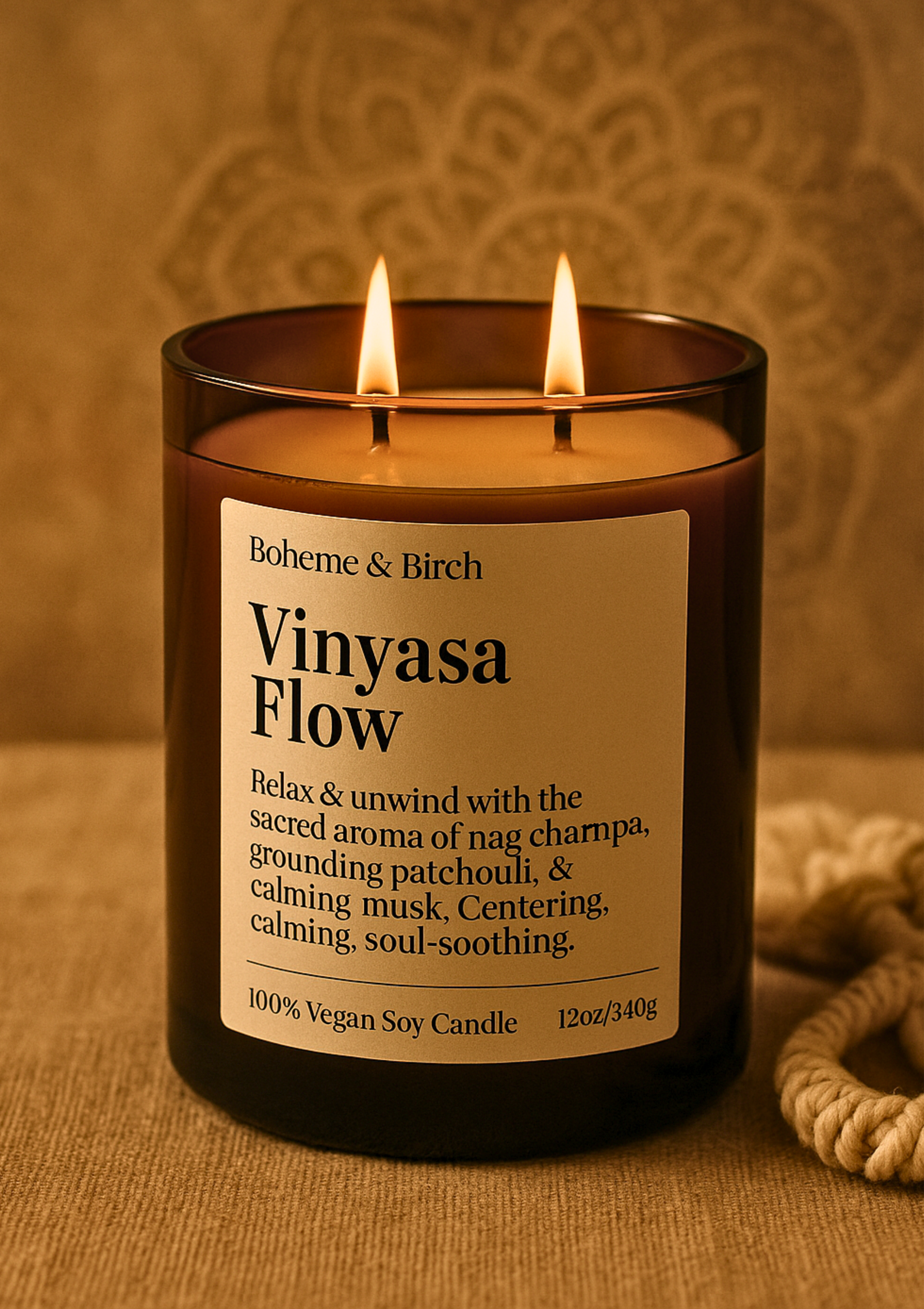 Two-wicked candle labeled 'Vinyasa Flow' by Boheme & Birch on a textured background.
