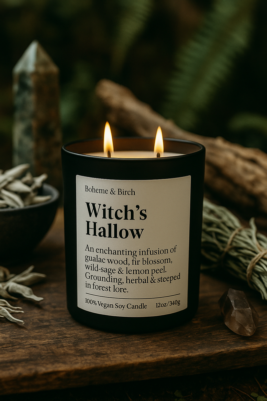 Witch's Hallow candle with label on a wooden surface with herbs and crystals.